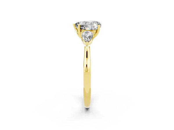 Yellow gold Three-Stone Heart Cut Moissanite Ring with Pear  Side Stones in Four-Prong Setting