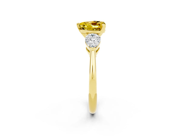 Yellow gold Three-Stone Heart Cut Yellow Sapphire Ring with Pear Side Stones and Four-Prong Setting
