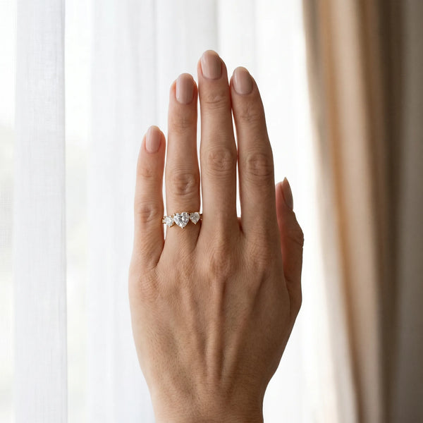 Yellow gold Three-Stone Heart Diamond Engagement Ring with Prong Setting on a Classic Band