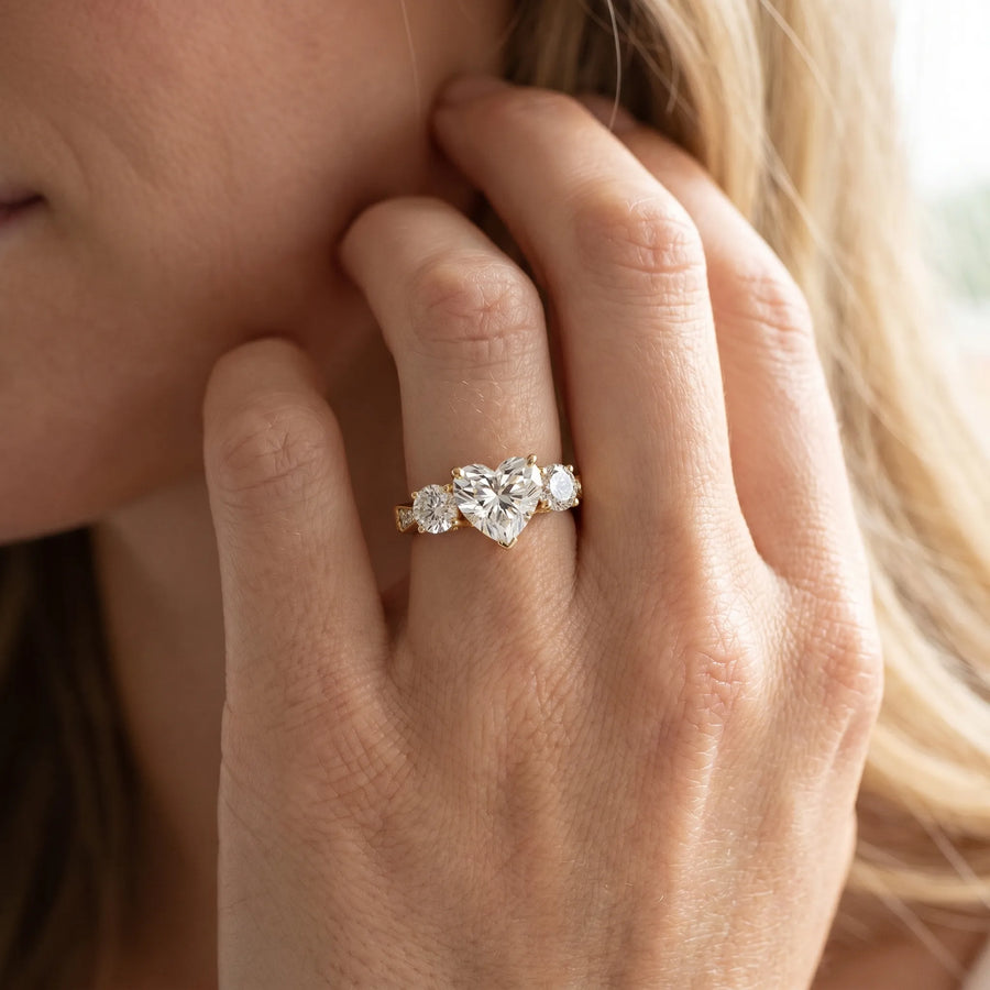 Yellow gold Three-Stone Heart Diamond Engagement Ring with Prong Setting on a Classic Band