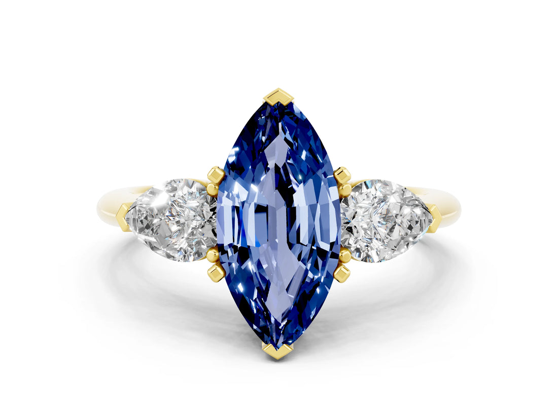 Yellow gold Three-Stone Marquise Cut Blue Sapphire Ring with Pear Side Stones and Four-Prong Setting