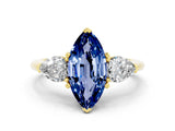 Yellow gold Three-Stone Marquise Cut Blue Sapphire Ring with Pear Side Stones and Four-Prong Setting