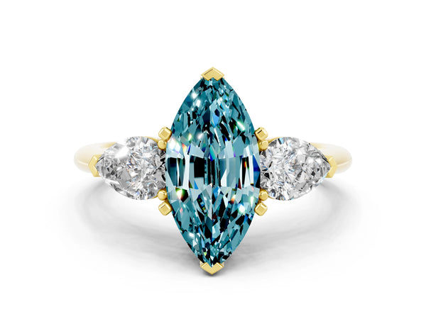 Yellow gold Three-Stone Marquise Cut Blue Topaz Ring with Pear Side Stones and Four-Prong Setting
