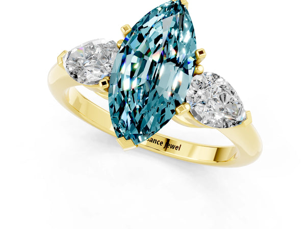 Yellow gold Three-Stone Marquise Cut Blue Topaz Ring with Pear Side Stones and Four-Prong Setting