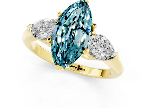 Yellow gold Three-Stone Marquise Cut Blue Topaz Ring with Pear Side Stones and Four-Prong Setting_1