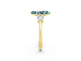 Yellow gold Three-Stone Marquise Cut Blue Topaz Ring with Pear Side Stones and Four-Prong Setting_2