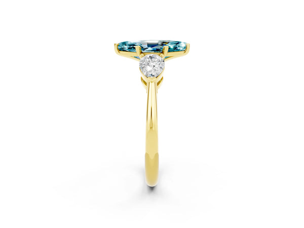 Yellow gold Three-Stone Marquise Cut Blue Topaz Ring with Pear Side Stones and Four-Prong Setting