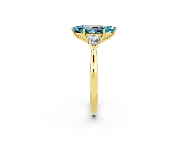 Yellow gold Three-Stone Marquise Cut Blue Topaz Ring with Pear  Side Stones in Four-Prong Setting