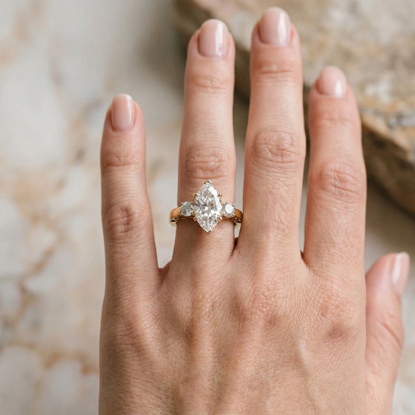 Yellow gold Three-Stone Marquise Cut Diamond Cathedral Engagement Ring with Prong Setting