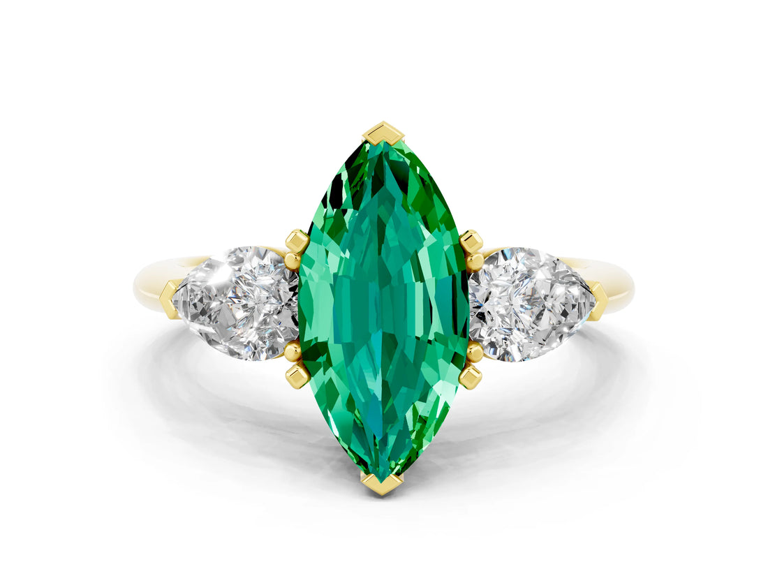 Yellow gold Three-Stone Marquise Cut Emerald Ring with Pear Side Stones and Four-Prong Setting