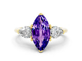 Yellow gold Three-Stone Marquise Cut Tanzanite Ring with Pear Side Stones and Four-Prong Setting