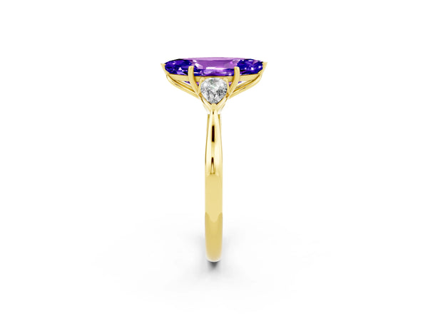 Yellow gold Three-Stone Marquise Cut Tanzanite Ring with Pear  Side Stones in Four-Prong Setting