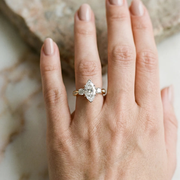 Yellow gold Three-Stone Marquise Diamond Channel Set Engagement Ring with Prong Setting
