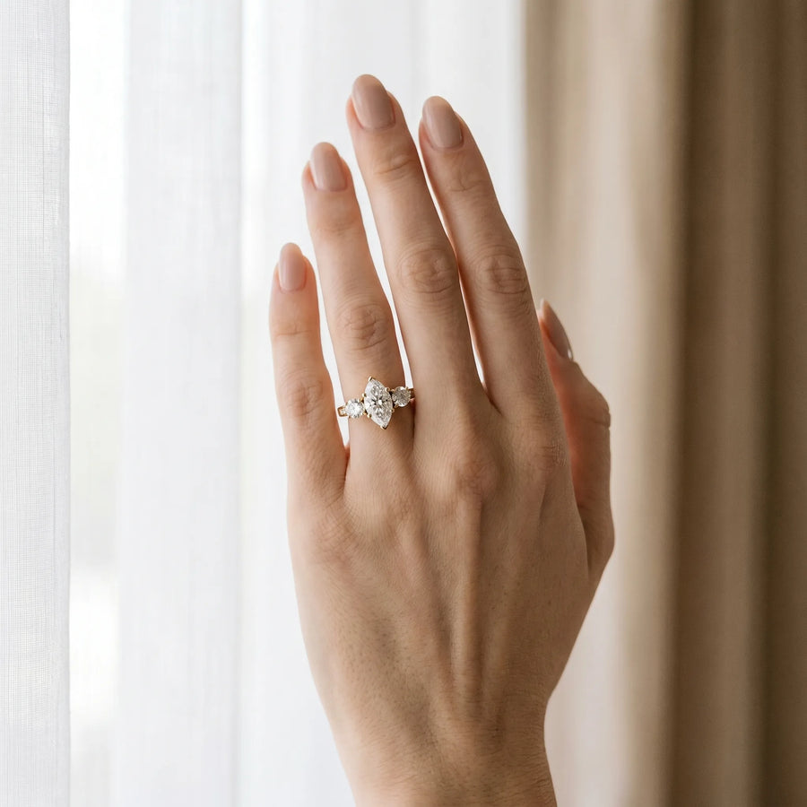 Yellow gold Three-Stone Marquise Diamond Engagement Ring with Prong Setting on a Classic Band