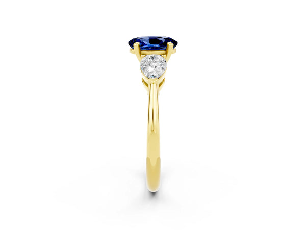 Yellow gold Three-Stone Oval Cut Blue Sapphire Ring with Pear Side Stones and Four-Prong Setting