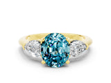 Yellow gold Three-Stone Oval Cut Blue Topaz Ring with Pear Side Stones and Four-Prong Setting