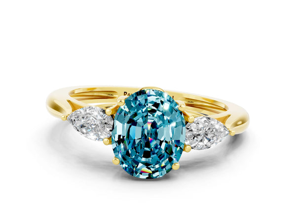 Yellow gold Three-Stone Oval Cut Blue Topaz Ring with Pear  Side Stones in Four-Prong Setting