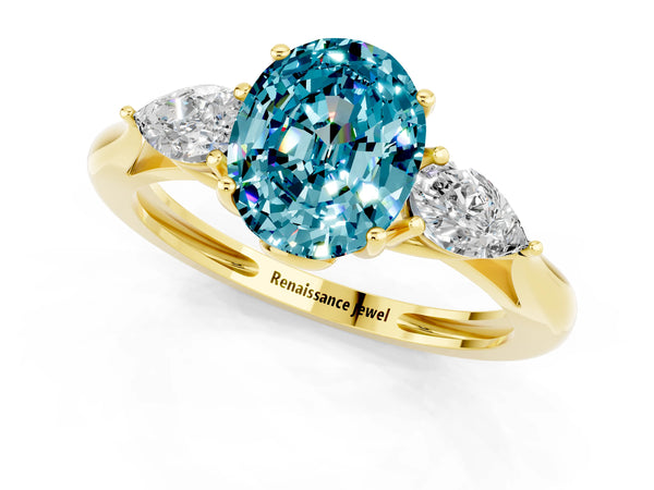 Yellow gold Three-Stone Oval Cut Blue Topaz Ring with Pear  Side Stones in Four-Prong Setting