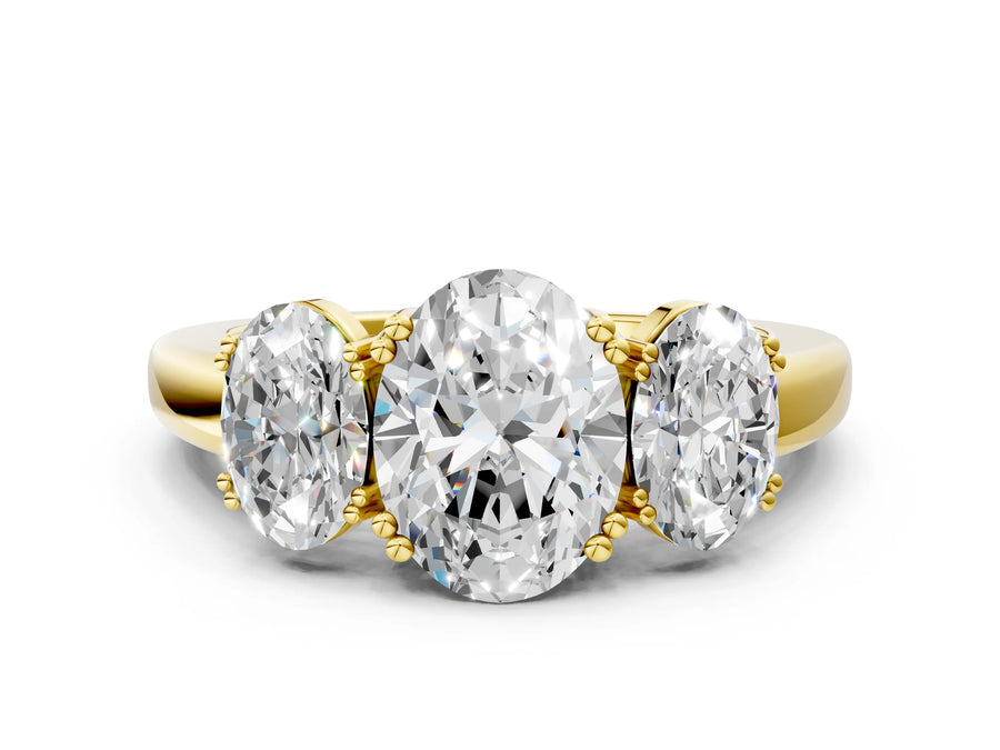 Yellow gold Three-Stone Oval Cut Cut Diamond Ring with Channel Set Band and Four-Prong Setting