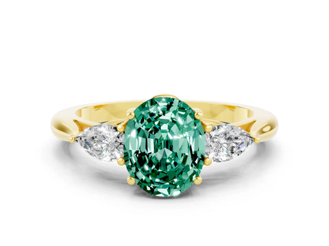 Yellow gold Three-Stone Oval Cut Cut Diamond Ring with Pear Side Stones in Four-Prong Setting