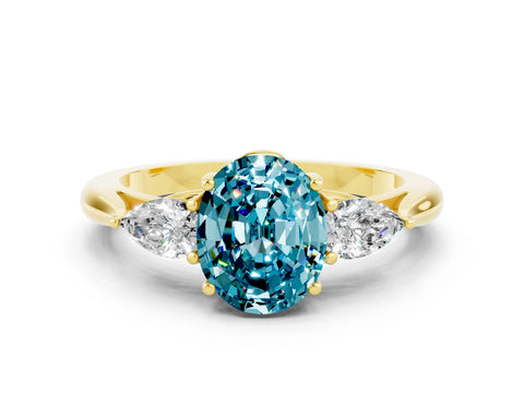 Yellow gold Three-Stone Oval Cut Cut Diamond Ring with Pear Side Stones in Four-Prong Setting