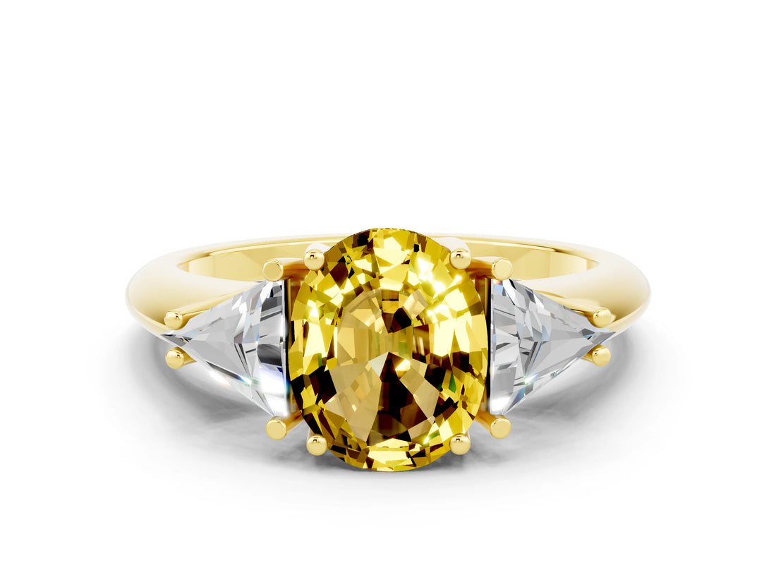 Yellow gold Three-Stone Oval Cut Cut Diamond Ring with Trillion Side Stones and Four-Prong Setting