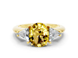 Yellow gold Three-Stone Oval Cut Cut Diamond Ring with Trillion Side Stones and Four-Prong Setting
