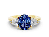 Yellow gold Three-Stone Oval Cut Cut Diamond Ring with Trillion Side Stones and Four-Prong Setting