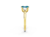 Yellow gold Three-Stone Oval Cut Cut Diamond Ring with Trillion Side Stones and Four-Prong Setting_2