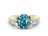 Yellow gold Three-Stone Oval Cut Cut Diamond Ring with Trillion Side Stones and Four-Prong Setting