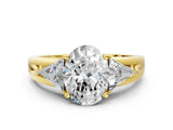 Yellow gold Three-Stone Oval Cut Cut Diamond Ring with Trillion Side Stones on a Split Shank Band_9