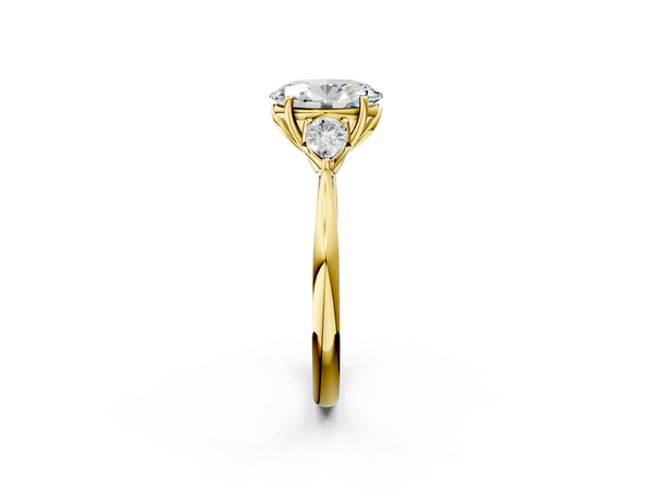 Yellow gold Three-Stone Oval Cut Diamond Ring with Pear Side Stones in Four-Prong Setting