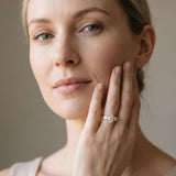 Yellow gold Three-Stone Oval Cut Diamond Ring with Round Accent Stones, Prong Setting, and Classic Band_48