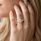 Yellow gold Three-Stone Oval Cut Diamond Ring with Round Accent Stones, Prong Setting, and Classic Band_49