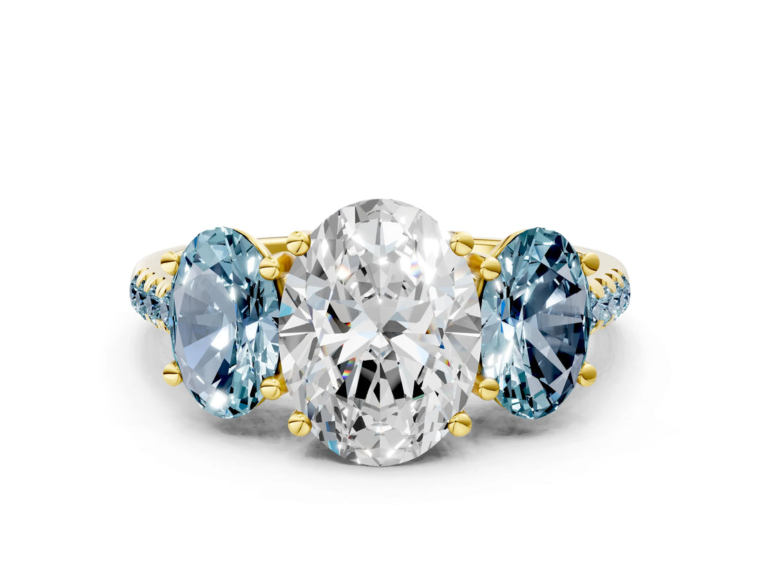 Yellow gold Three-Stone Oval Cut Diamond Ring with Round with Aquamarine side stone Pavé Band and Prong Setting