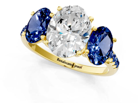 Yellow gold Three-Stone Oval Cut Diamond Ring with Round with Blue Sapphire side stone Pavé Band and Prong Setting_1