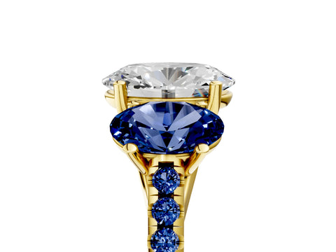 Yellow gold Three-Stone Oval Cut Diamond Ring with Round with Blue Sapphire side stone Pavé Band and Prong Setting_5