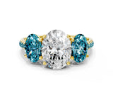 Yellow gold Three-Stone Oval Cut Diamond Ring with Round with Blue Topaz side stone Pavé Band and Prong Setting