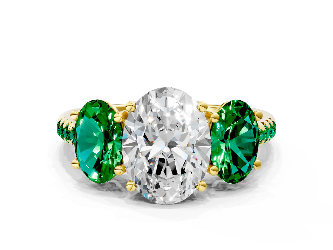 Yellow gold Three-Stone Oval Cut Diamond Ring with Round with Emerald side stone Pavé Band and Prong Setting