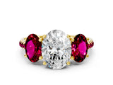 Yellow gold Three-Stone Oval Cut Diamond Ring with Round with Garnet side stone Pavé Band and Prong Setting