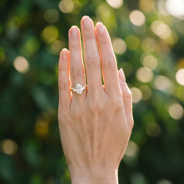 Yellow gold Three-Stone Oval Cut Diamond Solitaire with Prong Setting and Classic Band