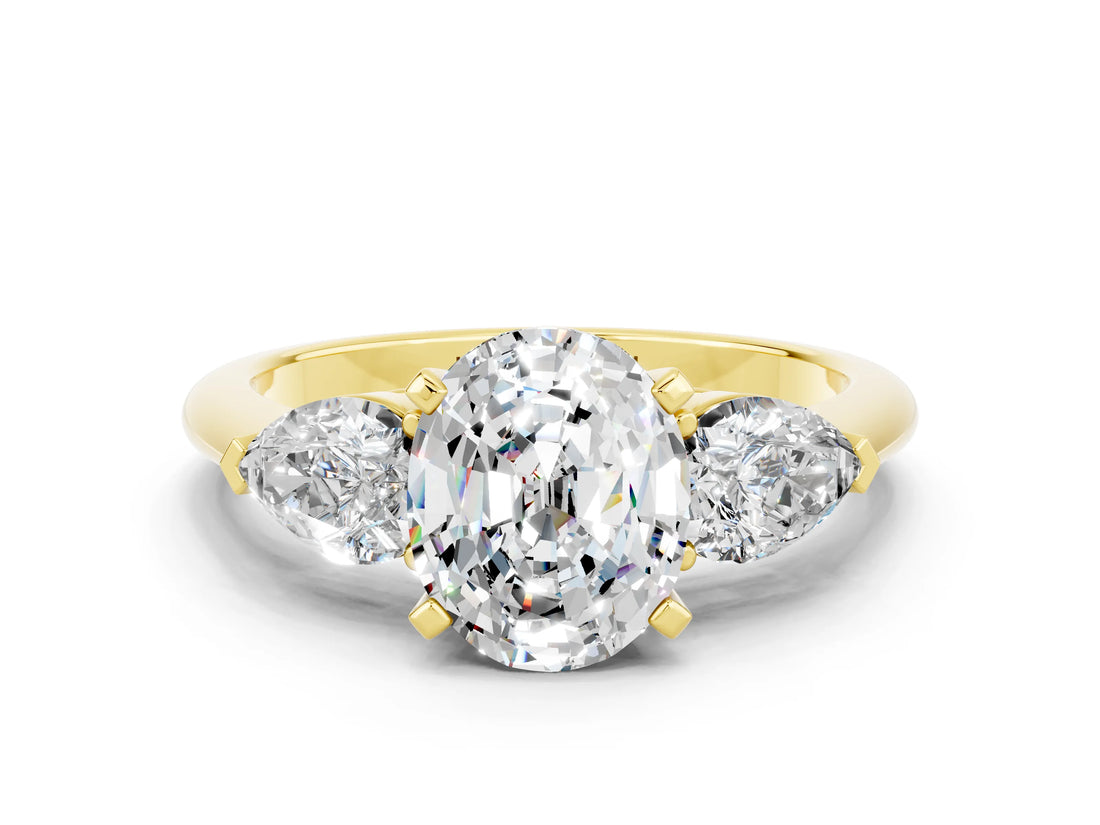 Yellow gold Three-Stone Oval Cut Moissanite Ring with Pear Side Stones and Four-Prong Setting