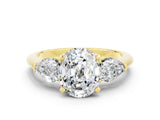 Yellow gold Three-Stone Oval Cut Moissanite Ring with Pear Side Stones and Four-Prong Setting