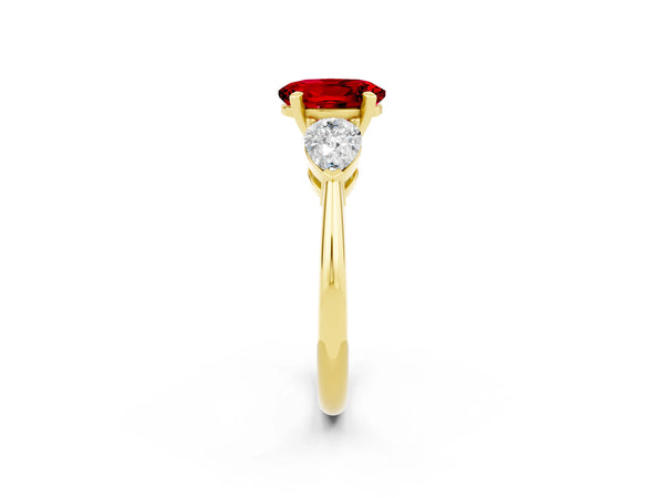 Yellow gold Three-Stone Oval Cut Ruby Ring with Pear Side Stones and Four-Prong Setting
