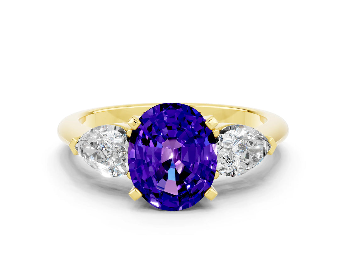 Yellow gold Three-Stone Oval Cut Tanzanite Ring with Pear Side Stones and Four-Prong Setting