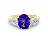 Yellow gold Three-Stone Oval Cut Tanzanite Ring with Pear Side Stones and Four-Prong Setting