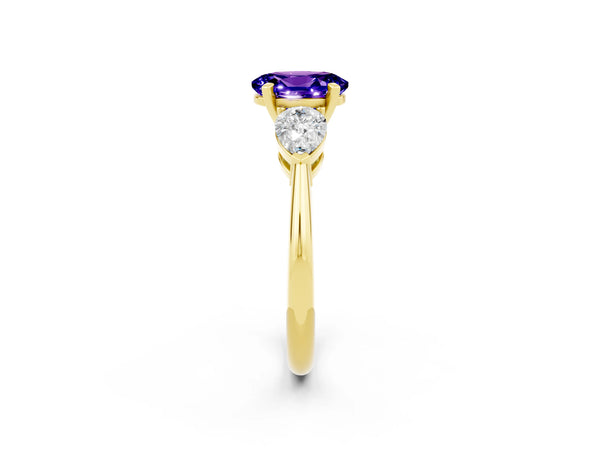 Yellow gold Three-Stone Oval Cut Tanzanite Ring with Pear Side Stones and Four-Prong Setting