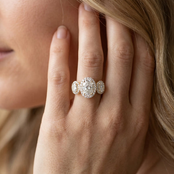 Yellow gold Three-Stone Oval Halo Diamond Ring with Pave Band and Four-Prong Setting