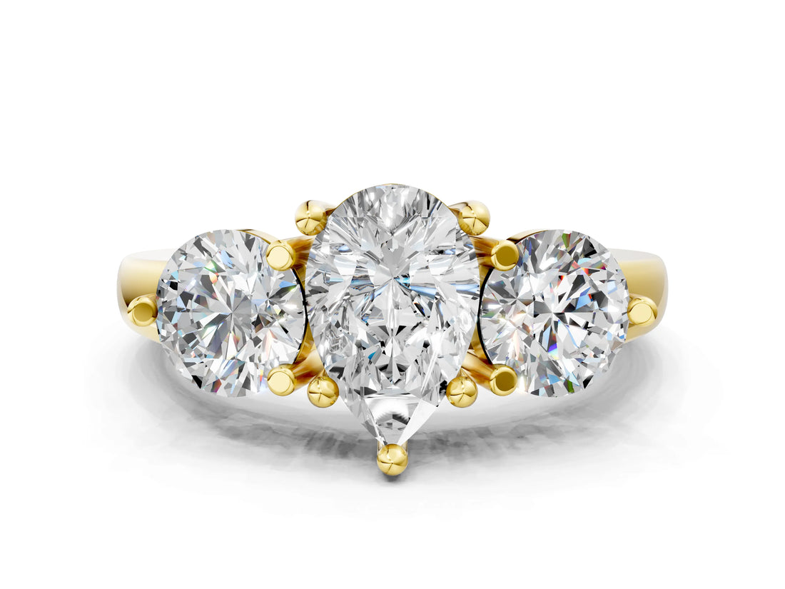 Yellow gold Three-Stone Pear Brilliant Cut Solitaire Ring with Prong Setting on a Classic Band