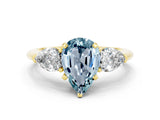 Yellow gold Three-Stone Pear Cut Aquamarine Ring with Pear Side Stones and Four-Prong Setting
